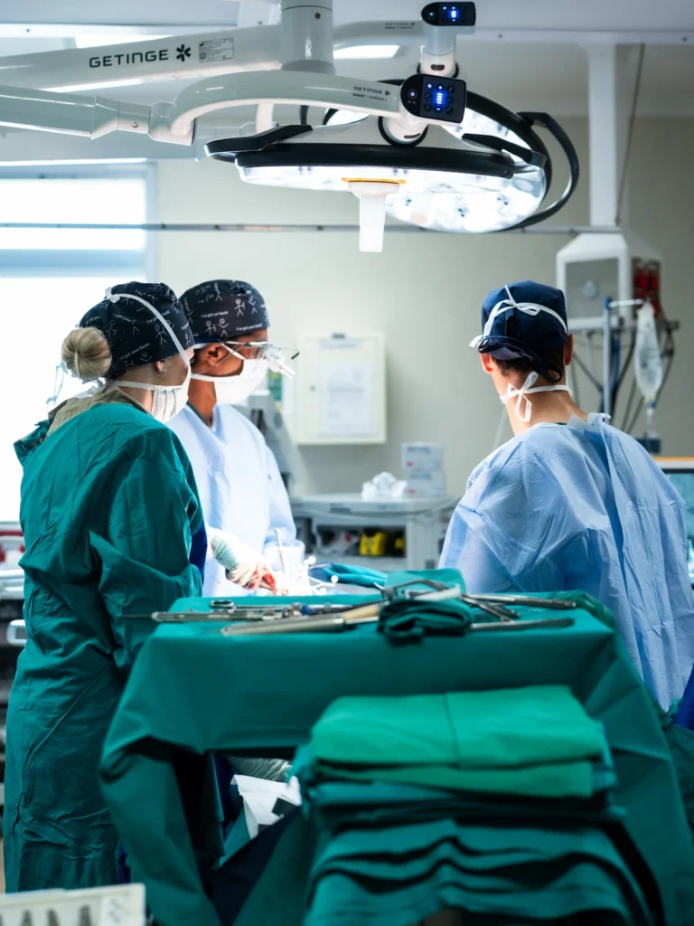 Dr Jaytesh Pillay and theatre staff performing complex spine surgery using specialised surgical instruments.