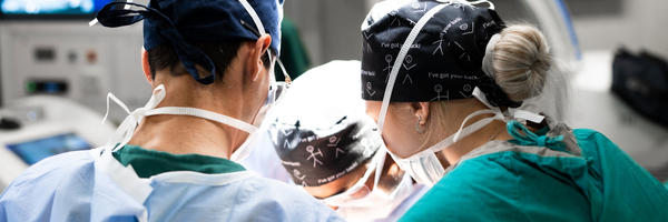 Specialist surgical team performing advanced spine surgery for a complex spinal condition