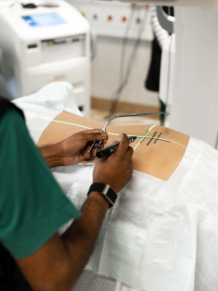 Specialist spine surgeon planning complex spine surgery using advanced navigation technology
