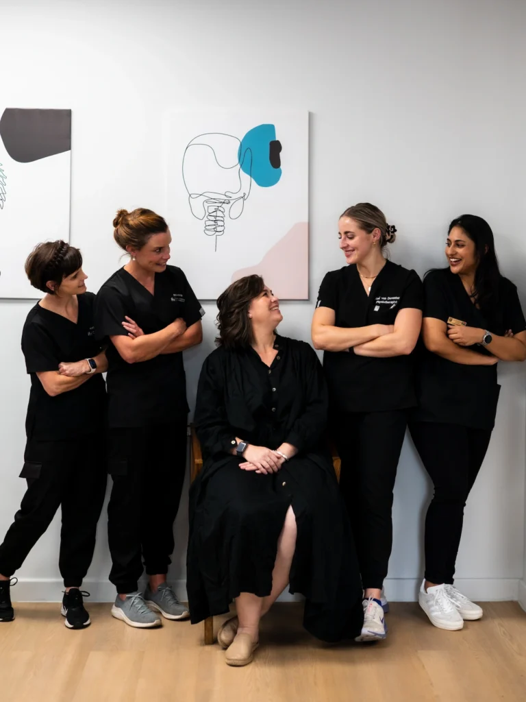 Physiotherapy team collaborating to provide coordinated rehabilitation and patient-centred spinal care.