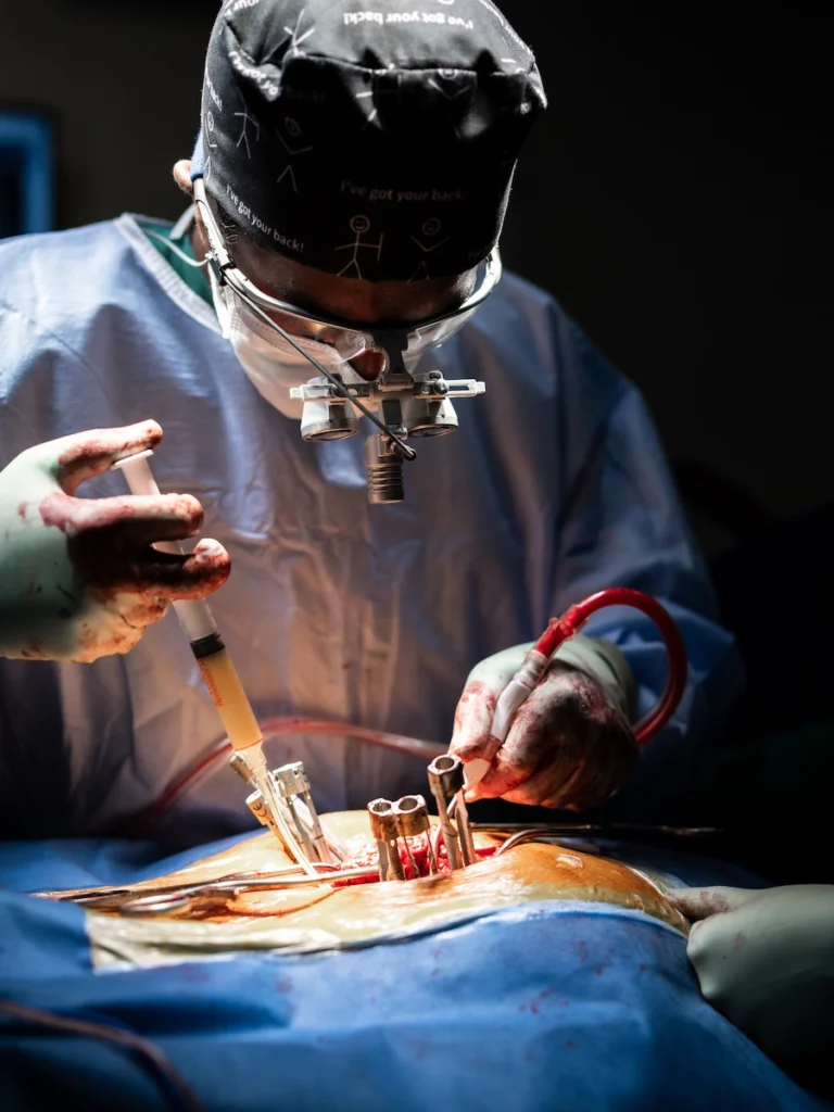 Dr Jaytesh Pillay performing complex spine trauma reconstruction surgery using advanced surgical techniques to restore spinal stability.
