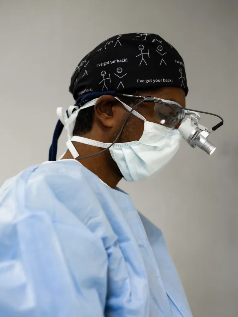 Dr Jaytesh Pillay preparing for modern spine surgery using advanced surgical techniques and precision technology.