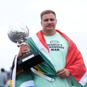 Rayno Nel holding the World's Strongest Man trophy after winning the 2025 competition